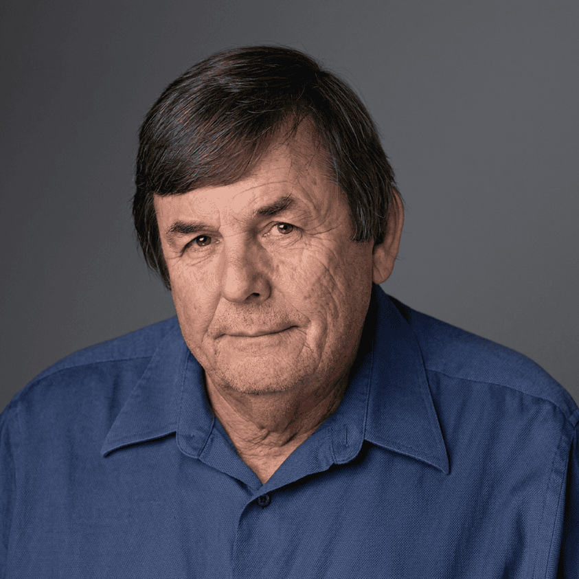Older man portrait in blue collared shirt