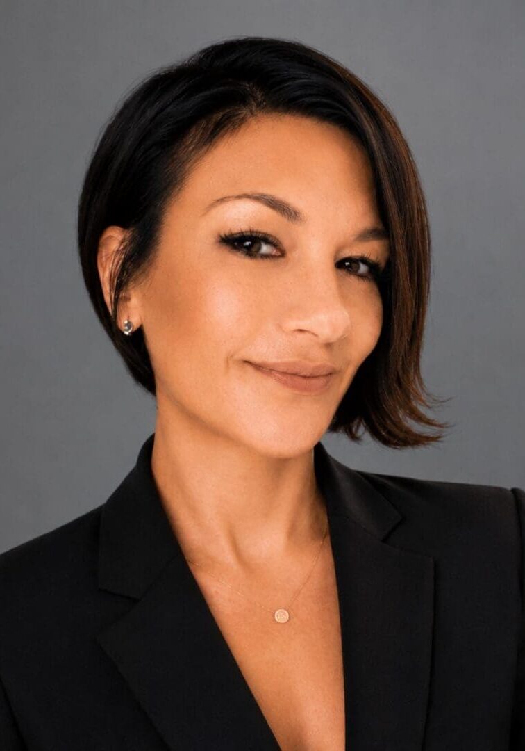 Smiling professional woman portrait in black blazer